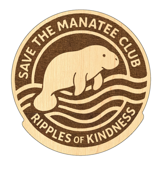 Round laser-engraved wooden magnet featuring a manatee above stylized waves, with the text “Save the Manatee Club” at the top and “Ripples of Kindness” at the bottom.